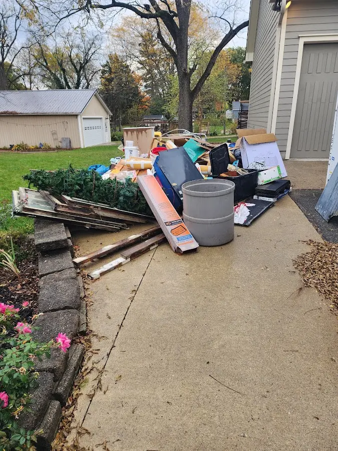 Dumpster being loaded with debris for Estate Cleanout Dumpster Rental in Union